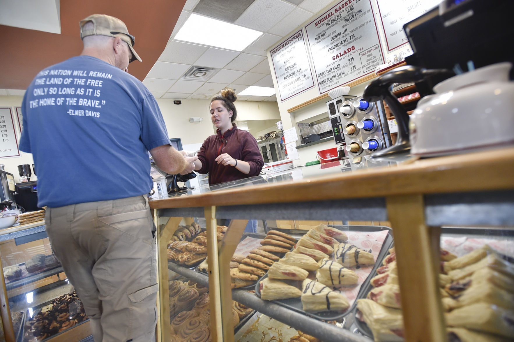 A customer pays for lunch in the Wheat Montana deli